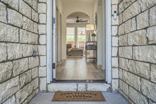 a doorway into a home with a brick wall at Cozy Family Retreat - Pet Friendly in Pflugerville