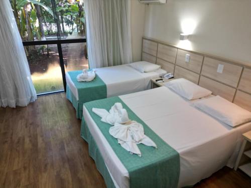 Postel nebo postele na pokoji v ubytování Hotel Nacional Inn Foz do Iguaçu