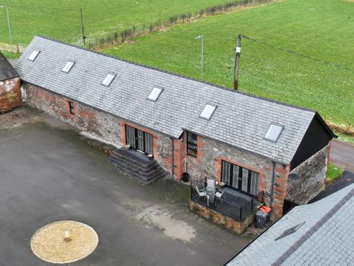 an aerial view of a house with a roof at The Steading in Dumfries