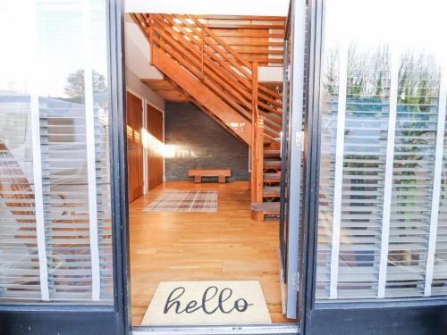 a hallway of a house with a hello sign in the window at The Steading in Dumfries