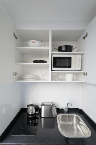 ครัวหรือมุมครัวของ Bay Room