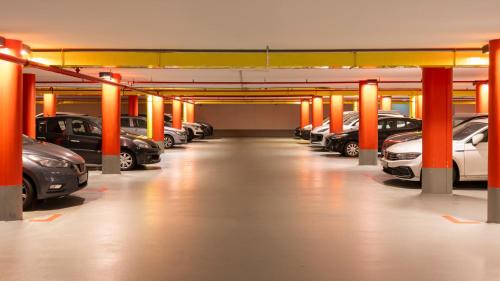 a large parking garage with cars parked in it at east Hotel Hamburg in Hamburg