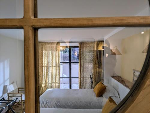 Ένα ή περισσότερα κρεβάτια σε δωμάτιο στο Villa des Oliviers