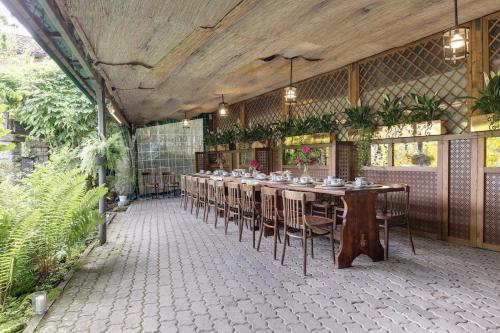 a large room with a long table and chairs at My Exclusive Italy - Entire Hilltop Villa with Private Pool in Palazzuolo sul Senio