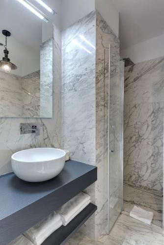 a bathroom with a sink and a glass shower at My Exclusive Italy - Entire Hilltop Villa with Private Pool in Palazzuolo sul Senio
