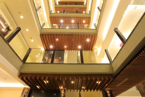 a view from the second floor of a building with escalators at Valentine Hotel in Ho Chi Minh City