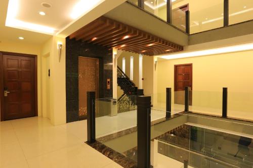 a hallway with a pool in the middle of a building at Valentine Hotel in Ho Chi Minh City