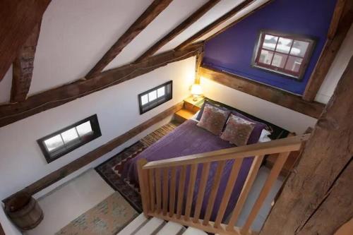 an overhead view of a bedroom with a bed in a attic at The Spirit Horse Farm, Kent Connecticut in Kent