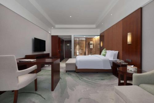 Televisyen dan/atau pusat hiburan di Wyndham Garden Qianjiang Downtown