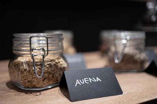 a sign sitting next to a jar of oatmeal at Riserva Bianca Limone Hotel & SPA in Limone Piemonte