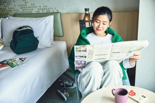 Letto o letti in una camera di Holiday Inn Kyoto Gojo
