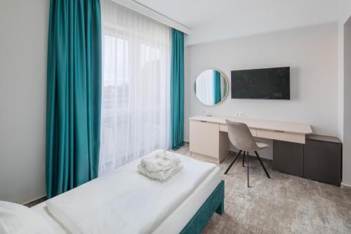 Hotel Atlantis Wellness & Conferenceにあるベッド