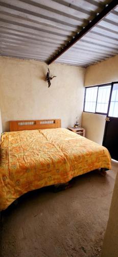 Postel nebo postele na pokoji v ubytování Quinta El Cocula camping, cabañas y eventos