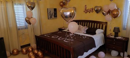 a childs bedroom with balloons and a bed with a crib at Casa Giò in Las Terrenas