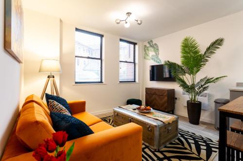 a living room with a couch and a table at Ivie's Place in Taunton