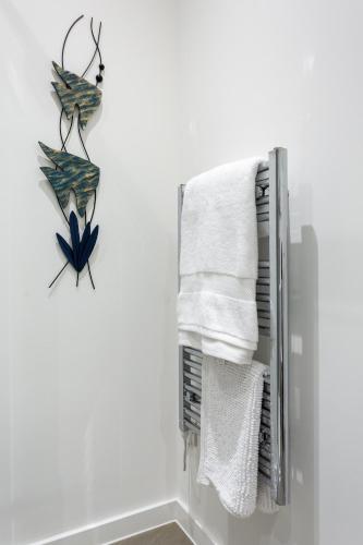 a towel rack in a bathroom with towels at Ivie's Place in Taunton