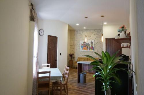 a kitchen and dining room with a table and chairs at Hotel Pietro Santo in Santeagueda