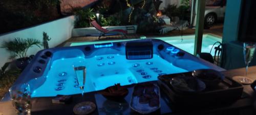 a blue poker table in a living room at maison de vacances Althéa in Saint-Pierre