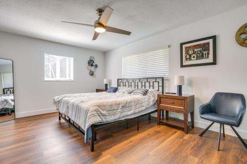 a bedroom with a bed and a desk and a chair at Downtown Retreat with Heated Pool & Backyard Patio in Fort Lauderdale