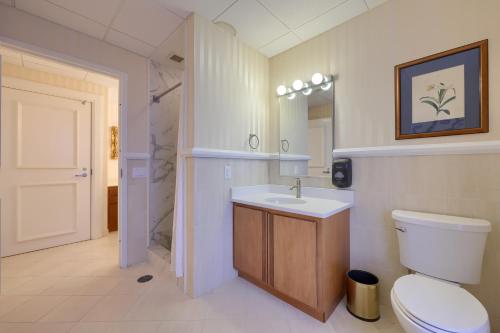 a bathroom with a toilet and a sink and a shower at The Executive Suites and Events in Ephrata