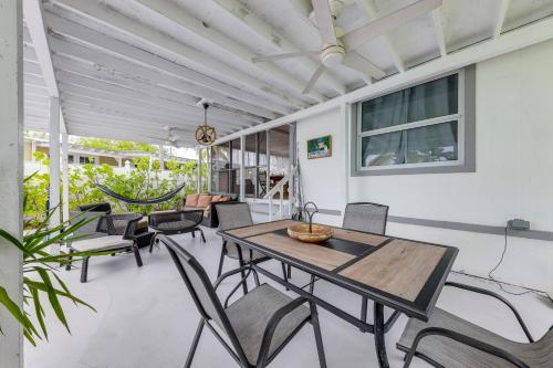 a dining room with a table and chairs at Lanai, Pool and Patios Waterfront Home in Tavernier in Tavernier