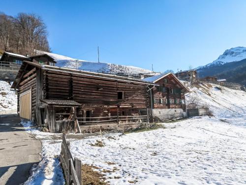 an old log cabin in the snow on a mountain at Holiday Home Im Rach by Interhome in Saas