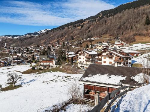 a small town in the snow with houses at Holiday Home Im Rach by Interhome in Saas