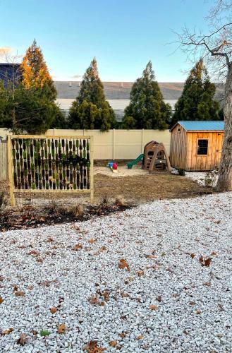 a backyard with a fence and a playground at 10 Braddock Somers Point in Somers Point