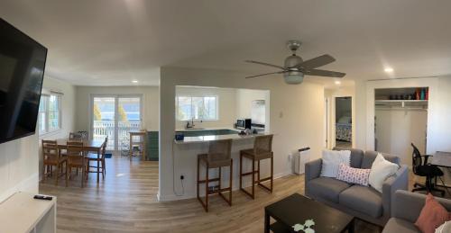 a living room and kitchen with a couch and a table at 10 Braddock Somers Point in Somers Point