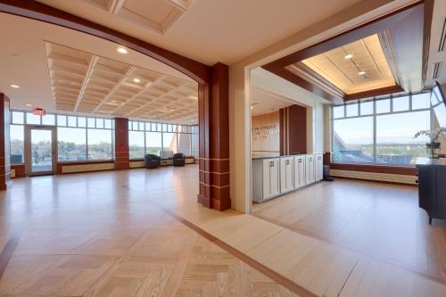 a large room with wood floors and large windows at The Executive Suites and Events in Ephrata