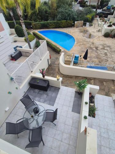 an aerial view of a patio with a swimming pool at 2 bedroom townhouse lower peyia paphos Cyprus in Peyia