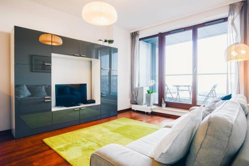 En eller flere senger på et rom på NORDA Apartamenty SEA TOWERS Gdynia