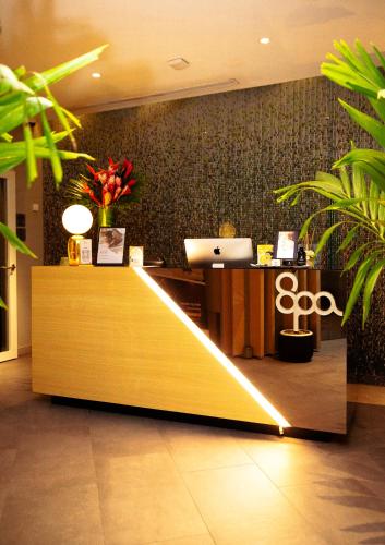 an office with a reception desk and a counter with at Noom Hotel Abidjan Plateau in Abidjan