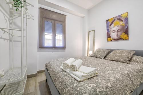 En eller flere senge i et værelse på Aires de Azahar & Parking Incluido