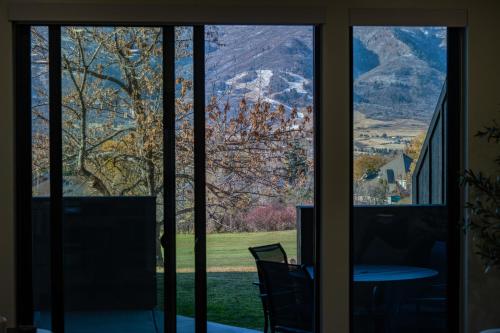 a window view of a mountain view from a house at Alpine Retreat at the Pointe Pt A106 in Eden