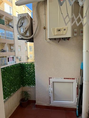 a view of a balcony with a toilet in a building at Apartment béni messous 1 in Ouled Beni Messous