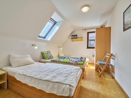 a bedroom with a bed and a couch in it at Holiday Home Stárkov by Interhome in Stárkov