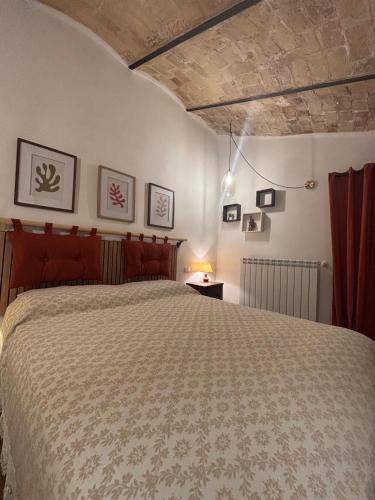 a bedroom with a large bed in a room at postAielli - Arte, Natura e Relax in Aielli