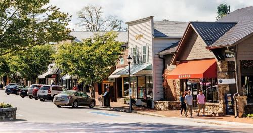 a street in a small town with cars parked at Highlands Escape with Views 5 Min to Downtown in Highlands
