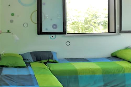 Ένα ή περισσότερα κρεβάτια σε δωμάτιο στο Comfortable Studio in Nicolosi, 25 m²