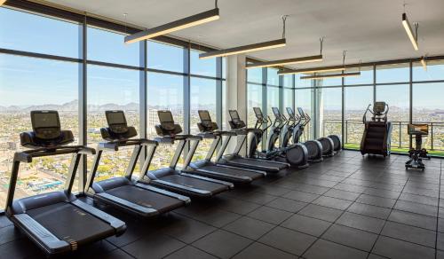 a gym with a row of treadmills at Global Luxury Suites at Downtown Phoenix in Phoenix