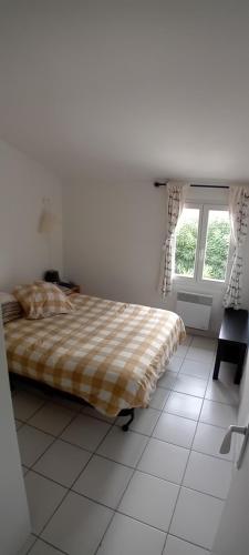 Posteľ alebo postele v izbe v ubytovaní Appartement à 8 km de la mer - 3 chambres