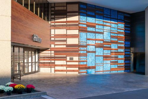 a building with a wall made out of wood at Hilton Lexington Downtown in Lexington