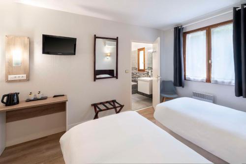 Ένα ή περισσότερα κρεβάτια σε δωμάτιο στο Sure Hotel by Best Western Saintes