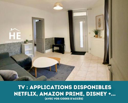 a living room with a couch and a table at Room Miami Proche Gare 400m in Montargis