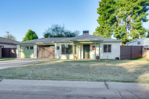 a white house with a red stop sign at Pet-Friendly Phoenix Home Breezeway and Fenced Yard in Phoenix