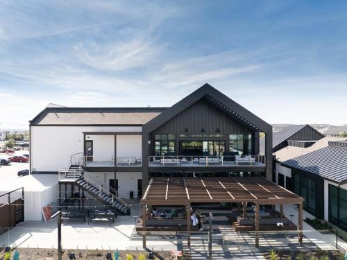 an aerial view of a building with a deck at 1B 1B Round Rock Pool, Sauna, On-Site Coffee Shop in Pflugerville