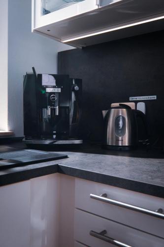 a kitchen with a coffee maker on a counter at Apartment 4 in Bad König