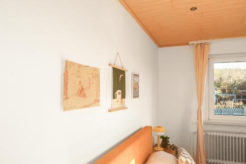 a living room with a couch and a window at Homestay - Panoramablick über Büdingen in Büdingen