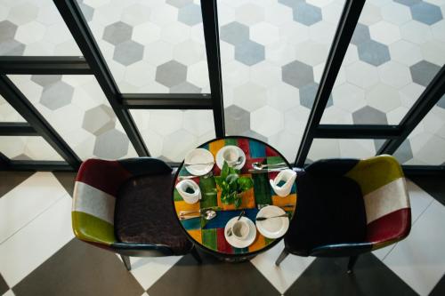 an overhead view of a table and two chairs at Verdant Hill Hotel Kuala Lumpur in Kuala Lumpur